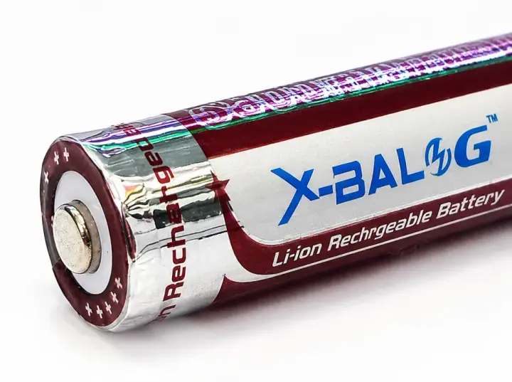 Плюсовий контакт та заводська етикетка X-BALOG зблизька